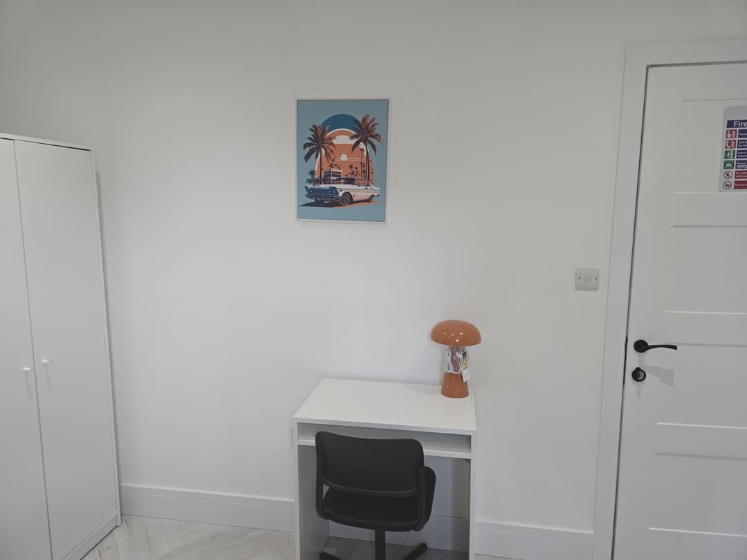 YCN Colney Home bedroom with desk, wardrobe and personal artwork